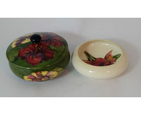Moorcroft round box & cover decorated in the hibiscus design and footed dish decorated with Orchids  (2)