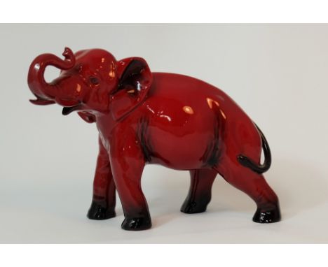 Royal Doulton Flambe Elephant with trunk in salute dated 1930, height 13.5cm