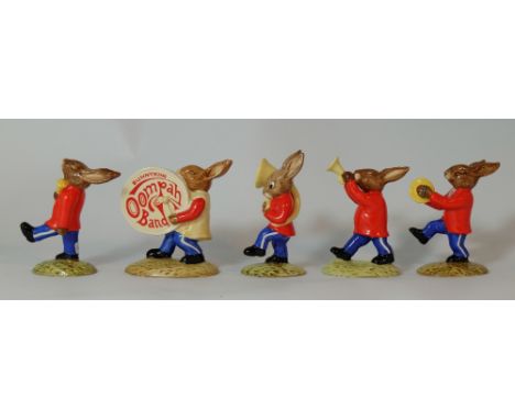 Royal Doulton Bunnkins Red Band set comprising Drummer DB26, Drum Major DB27, Cymbal DB25, Trumpeter DB24 and Sousaphone DB23