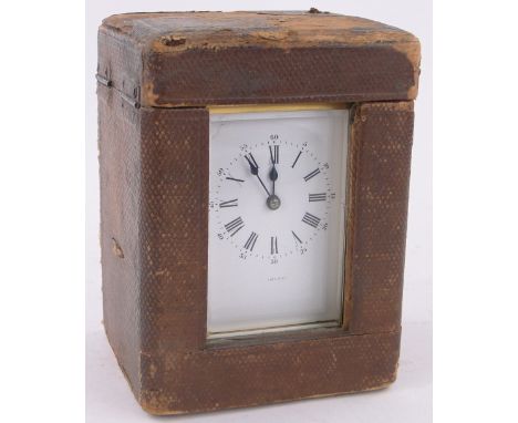 A French brass cased carriage clock,case height 11cm original leather travelling case.