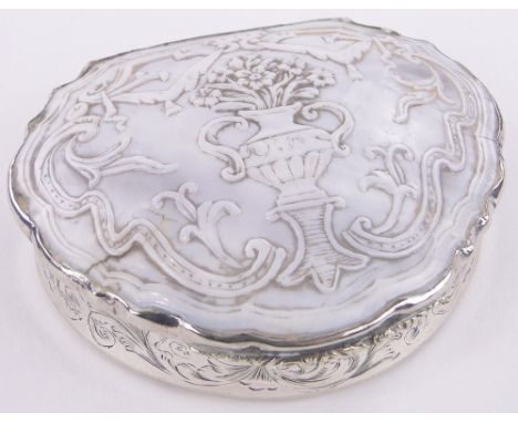An early 19th century unmarked white metal snuff box,the lid having an inset Cameo carved shell, with engraved concave sides 
