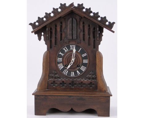 An unusual German carved wood cased clock with musical automaton military bugler figure,height 48cm.