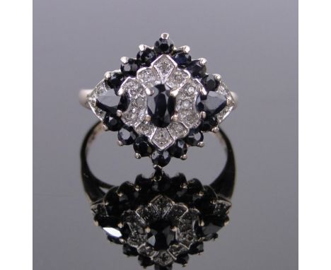 A 9ct gold sapphire and diamond cluster ring,setting height 15mm, size O.