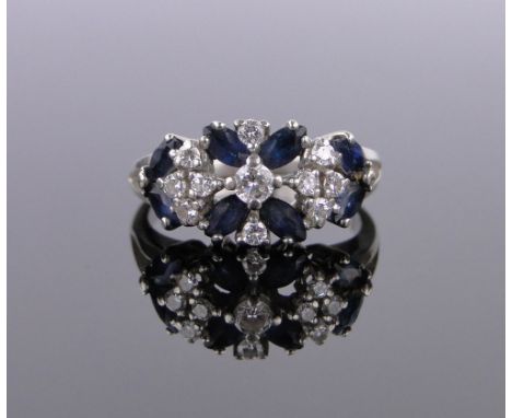 A 14ct white gold sapphire and diamond cluster ring,size N.