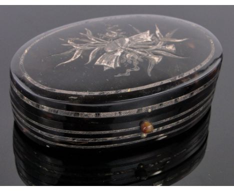 A 19th century oval tortoiseshell and silver inlaid snuff box,length 9cm.