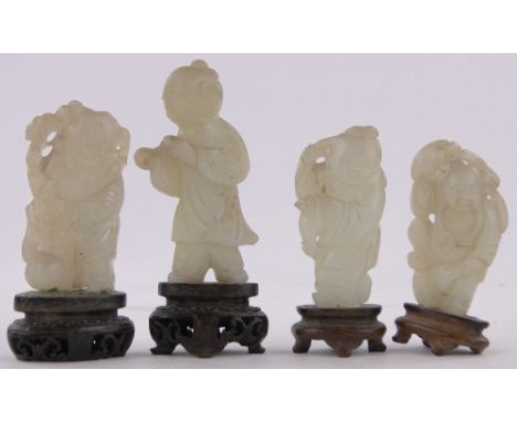 A group of 4 miniature Chinese carved jade Buddha figures,largest height 6cm.