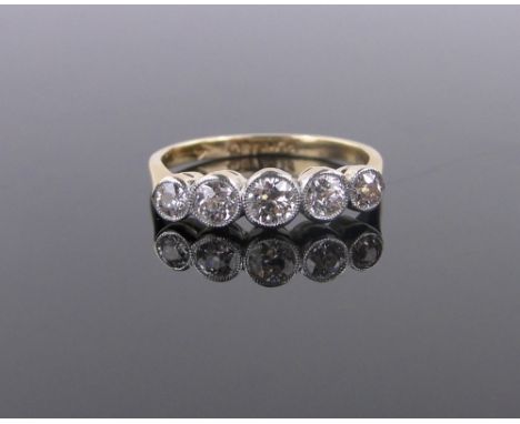 An 18ct gold and platinum 5 stone diamond ring,size L.