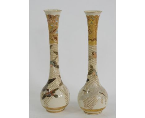A PAIR OF JAPANESE SATSUMA EARTHENWARE BOTTLE SHAPED VASES, DECORATED WITH BIRDS IN FLIGHT AND A RAISED GILT NET, 45CM H, PAI