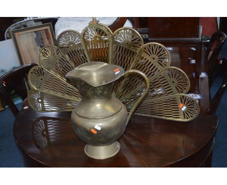 A BRASS FAN FIRE SCREEN together with a brass water jug (2)