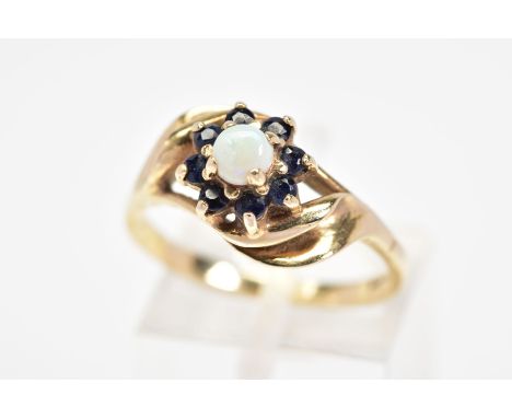 A 9CT GOLD OPAL AND SAPPHIRE CLUSTER RING, designed as a central circular opal cabochon within a circular sapphire surround, 