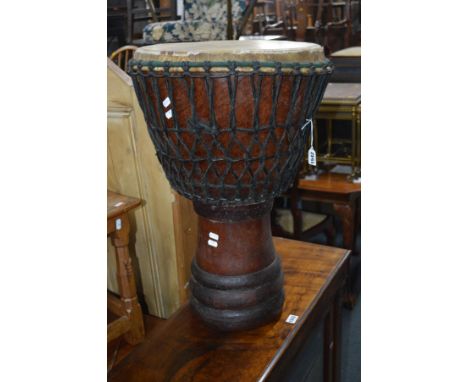 AN AFRICAN BONGO DRUM, diameter 41cm x height 65cm