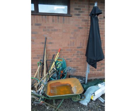 A WIND UP BANANNA PARASOL (sd) together with a boxed 1.5m hexagonal gazebo, two folding camping chairs, wheel barrow and a co