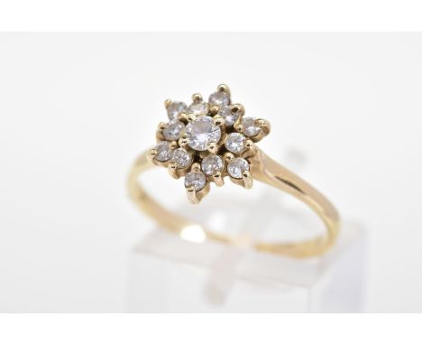 A DIAMOND CLUSTER RING, the tiered cluster set with thirteen round brilliant cut diamonds, to the plain polished band, total 