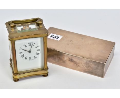 A BRASS CARRIAGE CLOCK AND A SILVER CIGARETTE BOX, the carriage clock with white face, black Roman numerals, glass sides and 