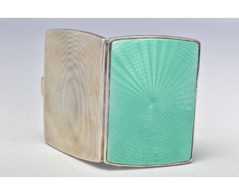 A GEORGE V SILVER CIGARETTE CASE OF RECTANGULAR FORM, engine turned and green enamel front, gilt interior, makers Deakin &amp