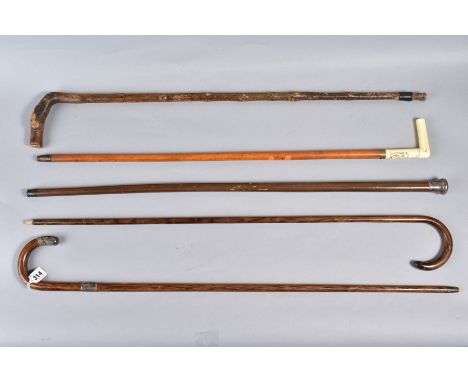 A QUANTITY OF WALKING STICKS, to include a silver topped stick, maker 'B.S.D. Cocke Victory 1919', (rubbed makers mark, Birmi