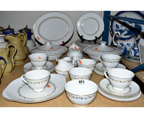 A ROYAL WORCESTER 'FAIRFAX' DINNER SERVICE, including meat platter, tureens and covers, gravy boat and stand, milk, sugar, cu
