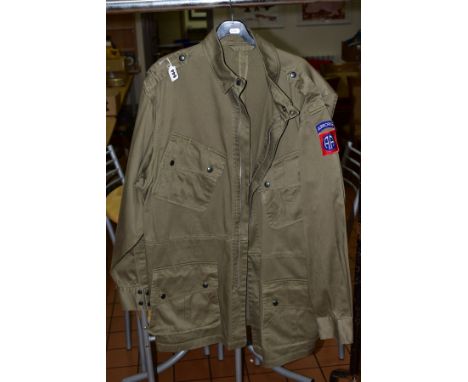 AN EXAMPLE OF AN M43 US PARATROOPERS JACKET FOR WWII, this has the QM label inside indicating the maker to be 'Sems Inc USA',