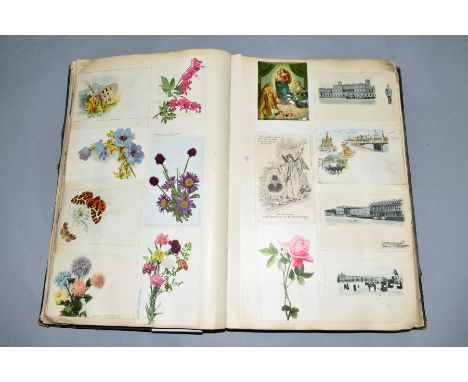 A LARGE POSTCARD/CUTTINGS ALBUM, containing over one thousand postcards, photographs and other ephemera from the Victorian / 