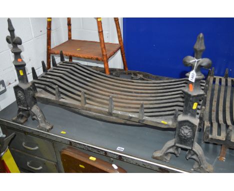 A LARGE CAST IRON FIRE GRATE on a pair of fire dogs, width 91cm