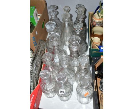 A GROUP OF FIFTEEN GEORGIAN LATER DECANTERS to include a pair of decanters having triple ring necks and star cut base, a pair