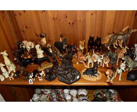 A COLLECTION OF ORNAMENTAL DOG SCULPTURES, to include Beswick Doberman Pincher No.2299, Sheepdog No.1854 and Cocker Spaniel l