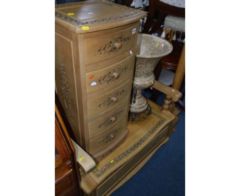 A MODERN CARVED LIGHTWOOD MONKS BENCH, width 97cm, a matching bow front chest of five short drawers, width 42cm x height 90cm