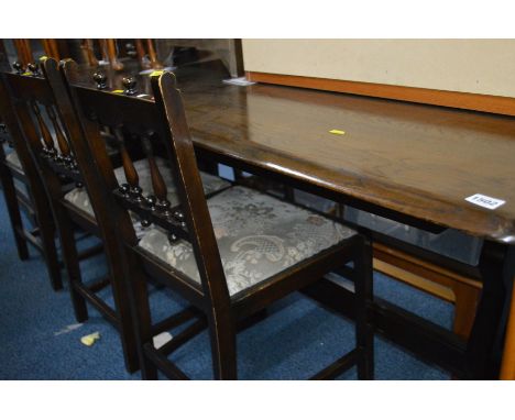 AN ERCOL MEDIUM OAK REFECTORY TABLE, length 183cm and four Ercol chairs (5)