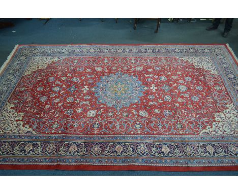 A LARGE LATE 20TH CENTURY 100% WOOLLEN SAROUK RED AND BLUE GROUND CARPET SQUARE, marked to underside G H Frith Ltd, 518cm x 3