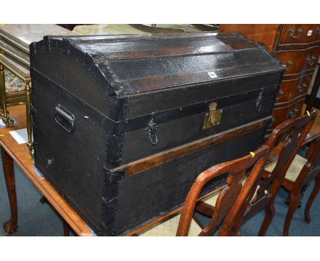 A VINTAGE OAK BOUND DOMED TOPPED TRUNK with an internal tray, width 84cm x depth 51cm x height 59cm together with a small mir