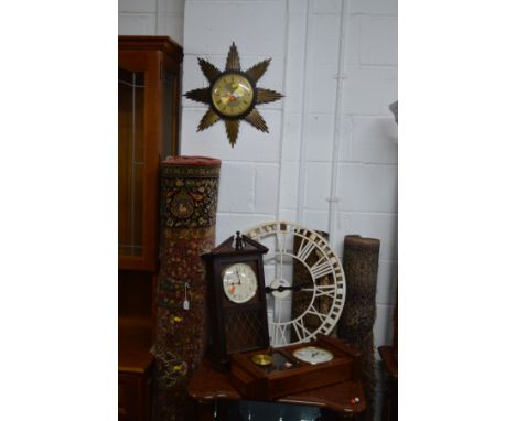 A METAMEC SUNBURST CLOCK together with a modern painted metal garden clock  with Roman numeral figures around edge, diameter 