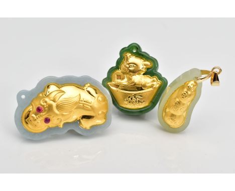 THREE JADE PENDANTS, designed as carved polished shapes with embossed yellow metal panels to one side, including a dragon and