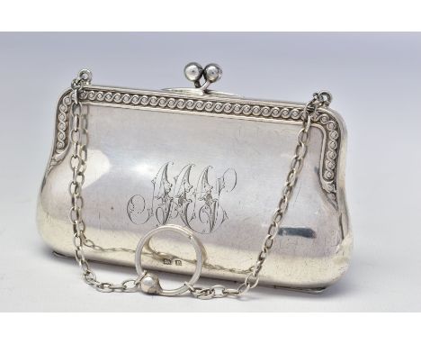 A GEORGE V SILVER PURSE, scrolled edges, engraved initials, on a chain with finger ring, brown leather lined interior, maker 
