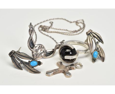 FOUR ITEMS OF JEWELLERY, to include a Gucci ring designed with black sphere within a G-shape mount, with maker's mark, ring s