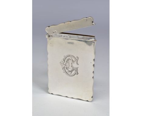 AN EDWARDIAN SILVER CARD CASE OF WAVY RECTANGULAR FORM, engraved monogram to front, maker Willaim  Neale, Chester 1901, 2ozt,