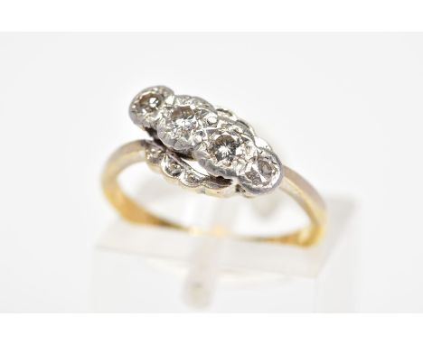 A FOUR STONE DIAMOND RING, designed as a diagonal line of slightly graduated brilliant and single cut diamonds within illusio