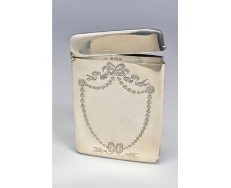 AN EDWARDIAN SILVER CARD CASE OF RECTANGULAR FORM, engraved with ribbons and swags in the shape of a shield to both sides, ma