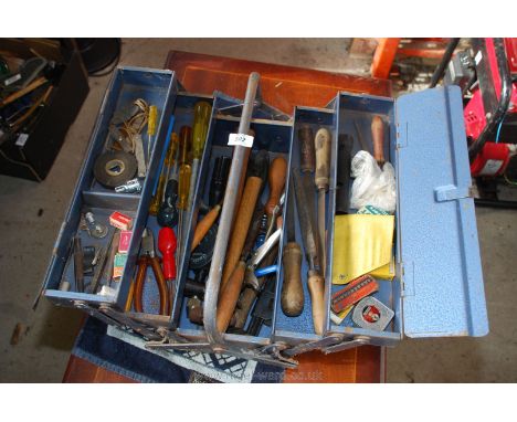 A cantilever metal tool box and contents.