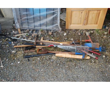 Quantity of garden forks, rakes, edging tools and spade.