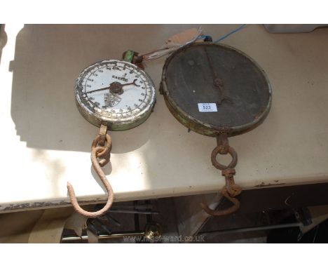 Two spring balance scales.