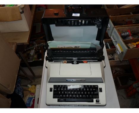 A portable electric typewriter.