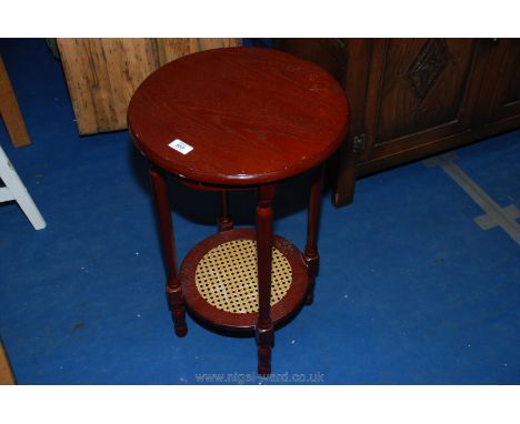 Circular wine table with cane under shelf 25" high x 16" diameter.