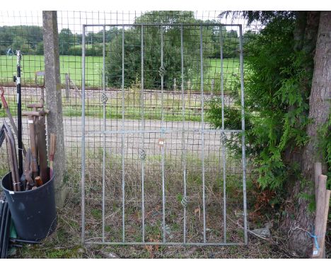 Nine stay metal gate with basket design, 53'' wide x 70'' high.