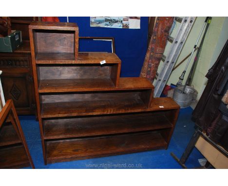 Five shelf wooden bookcase, 51" long x 48" high x 8" deep.