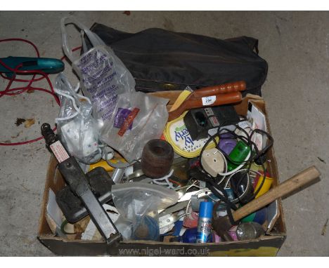 A box of tools, door handles, car jack and workshop miscellanea.