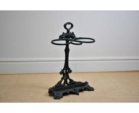 A Coalbrookdale style cast iron stick stand, on serpentine base, height 73cm, with a Dutch white metal spoon, and other silve