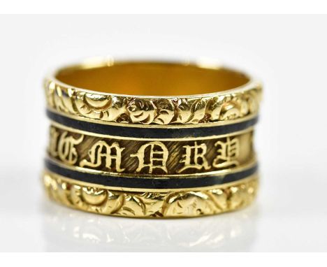 An 18ct yellow gold black enamelled mourning ring, the outer band inscribed 'In Memory Of', the interior engraved 'Anne Nairn