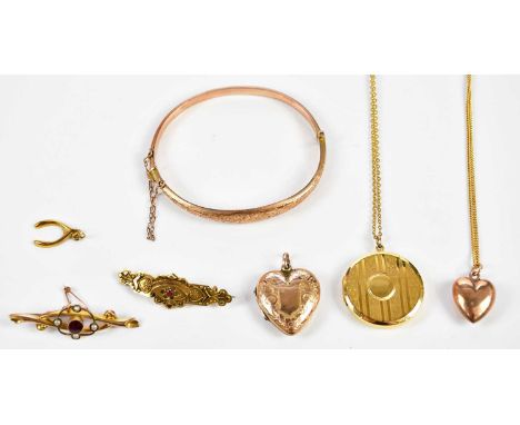 A group of 9ct gold and yellow metal jewellery, including a bangle, pendant on chain, brooch, etc, combined approx. 22.8g.