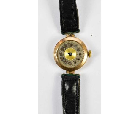 A vintage 9ct yellow gold watch head set with Arabic numerals to the circular dial and on later leather bracelet.
