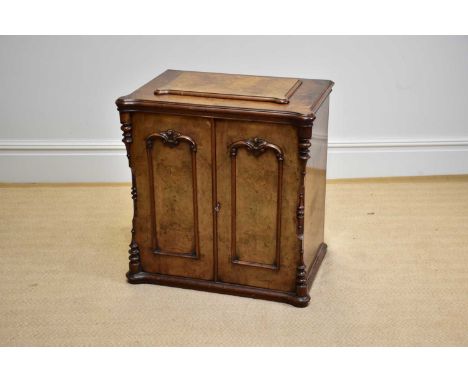 A 19th century walnut sewing machine cabinet, the pair of panel doors enclosing single fixed shelf, width 72cm, depth 47cm, h